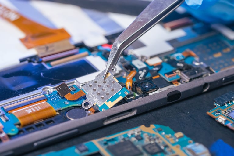 Technician repairing smartphone